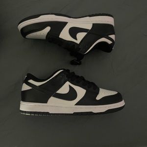 Black and white Nike dunk lows gs